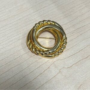 Gold tone Brooch. Twisted circle. Safety pin.  1 1/2”